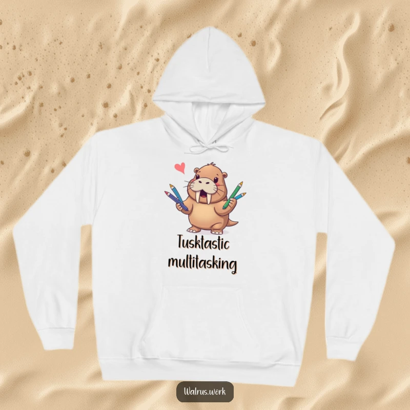Funny hoodie depicting a joyful walrus expertly juggling multiple colorful pens in a whimsical, entertaining scene.