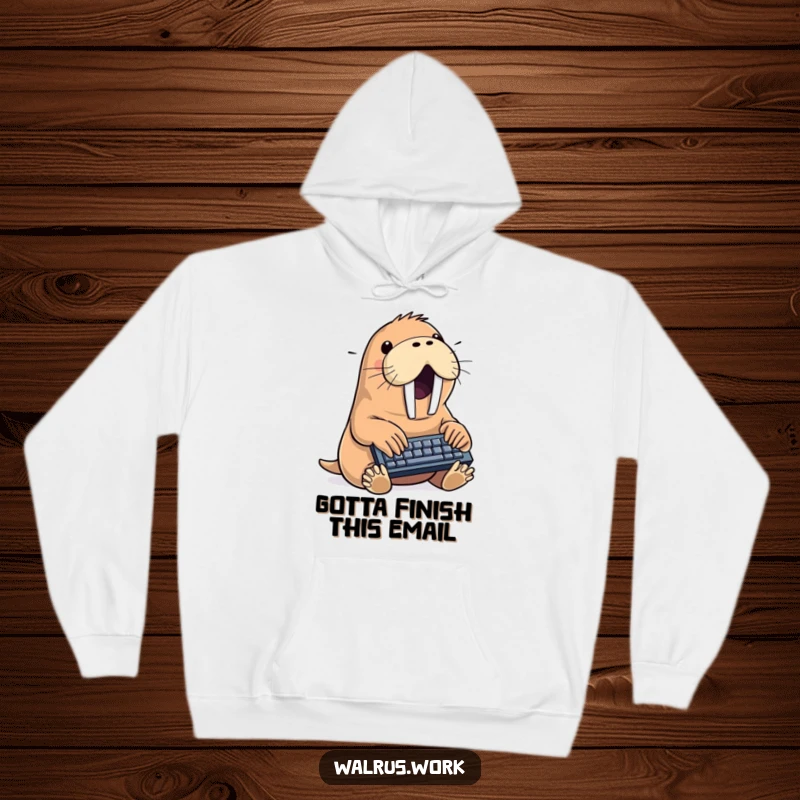 Funny walrus hoodie showing a happy sea creature typing with intensity on a small keyboard, perfect for cozy humor lovers.