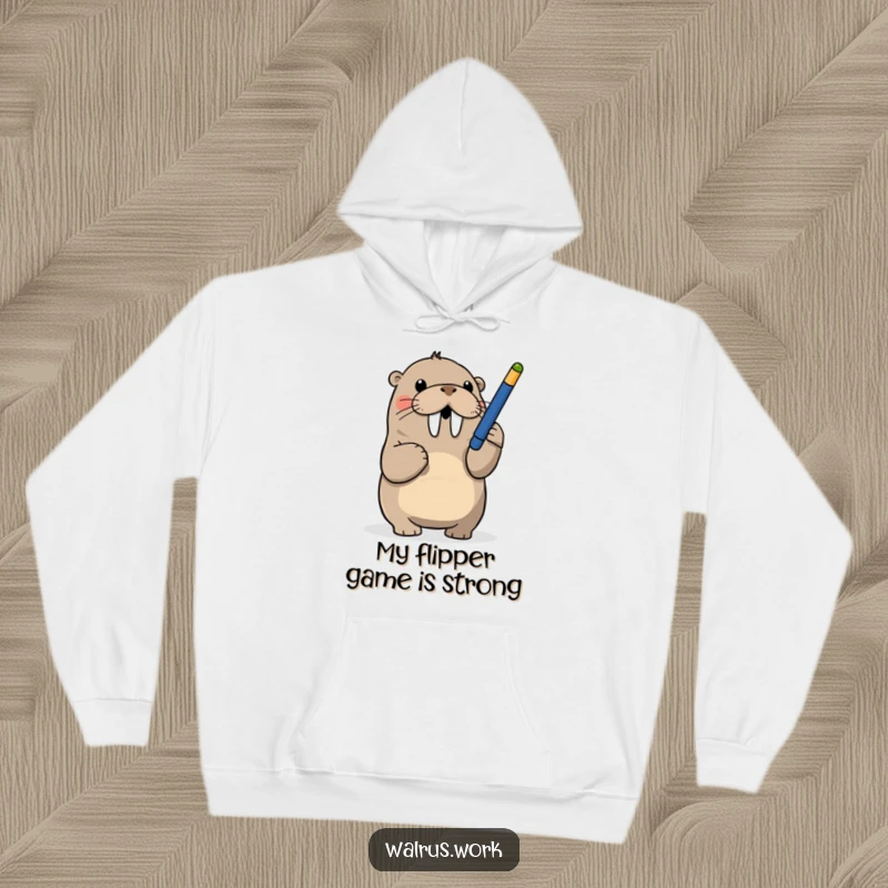 Funny hoodie with a walrus playfully batting at a dangling pen, a humorous and cozy piece of apparel.